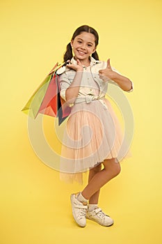 Best discounts and promo codes. Girl carries shopping bags. Back to school season great time to teach budgeting basics