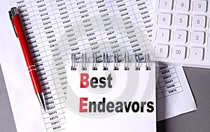 BEST ENDEAVORS text on notebook with chart , pen and calculator photo
