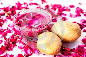 Best face mask or face pack to reduce blemishes and dark patches isolated on white i.e. Rose petals well mixed with potato juice photo
