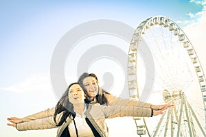 Best female friends enjoying time together outdoors at luna park