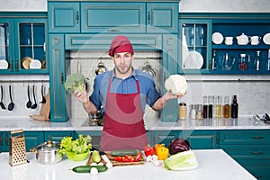 Best food. Healthy food. Vegetarian recipe. Vegan chef in kitchen. Dieting and organic food. Bearded man cook. Chef man