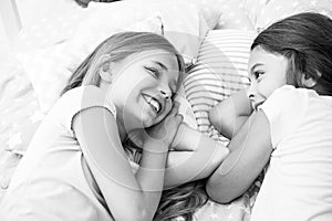 Best friends forever. Girls relaxing on bed. Slumber party concept. Girls just want to have fun. Invite friend for