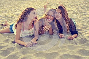 Best friends girls at sunset beach sand