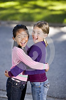 Best friends hugging and laughing