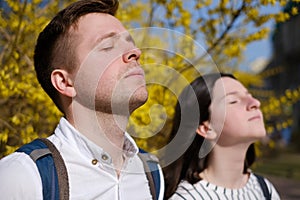 The best friends man and woman bask in the sun