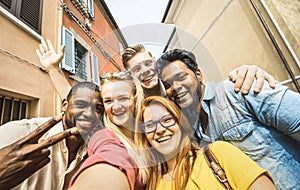 Best friends multiracial people taking selfie outdoors