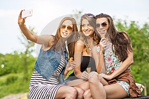 The best friends. Selfie - Three beautiful woman eating ice cream