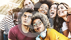 Best friends taking selfie outdoors - Happy young people portrait making funny faces together - Teenagers having fun outside