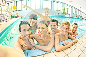 Best friends taking selfie in swimming pool - Happy friendship