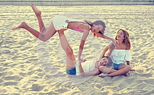 Best friends teen girls fun in a beach sunset