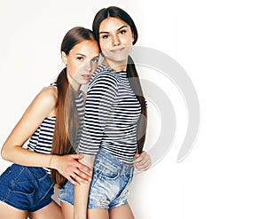 Best friends teenage girls together having fun, posing emotional on white background, besties happy smiling, lifestyle