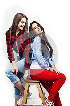 Best friends teenage girls together having fun, posing emotional on white background, besties happy smiling, lifestyle