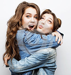 Best friends teenage girls together having fun, posing emotional on white background, besties happy smiling, lifestyle