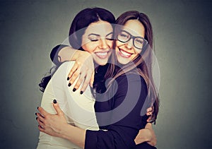 Best friends two women hugging each other photo