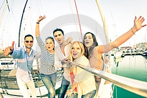 Best friends using selfie stick taking pic on exclusive sailboat