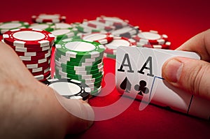 Best gamble in poker or lucky hand concept with player going all in with pocket aces two aces considered the best hand in poker photo