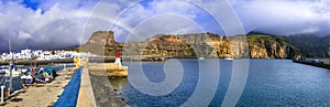 Best of Gran Canaria island - scenic Puerto de las Nieves, panorama of old port with rainbow photo