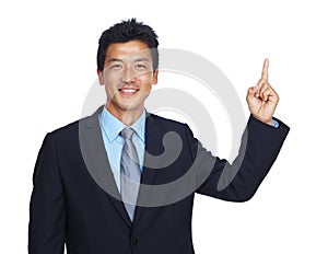 This is the best idea Ive had all day. An isolated portrait of a happy young businessman pointing upwards.