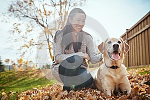 The best kind of friend has fur and four legs. an attractive young woman having fun with her dog on an autumn day in a