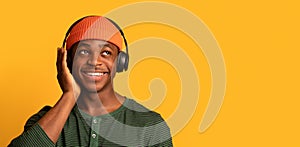 Best Music. Closeup Shot Of Happy Young Black Man In Wireless Headphones