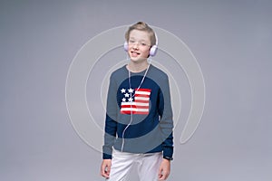 Best music. Happy guy in headphones enjoying his favorite songs and smiling