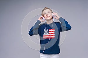 Best music. Happy guy in headphones enjoying his favorite songs and smiling