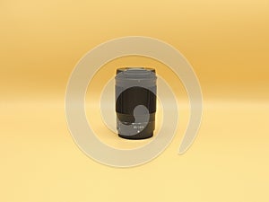 Best portrait lens Nikon Nikkor Z 85mm 1.8 S black on yellow background. Opinion of the European Association photo