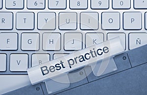 Best practice - Inscription on Blue Keyboard Key photo
