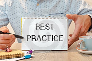Best Practice is written on a notepad on office desk