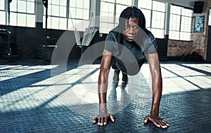 The best project youll ever work on is you. a young man doing push ups in a gym.