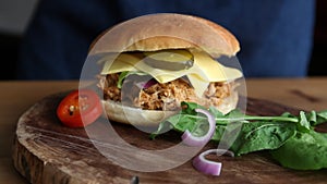 Best pulled pork sandwich on dark wood board