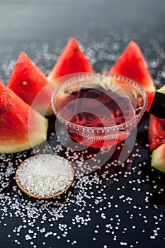 Best recipe ingredient to make homemade sugar scrub on wooden surface consisting of watermelon pulp well mixed with sugar in a