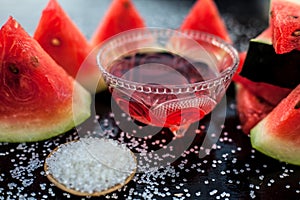 Best recipe ingredient to make homemade sugar scrub on wooden surface consisting of watermelon pulp well mixed with sugar in a