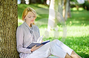 Best self help books for women. Books every girl should read. Girl concentrated sit park lean tree trunk read book