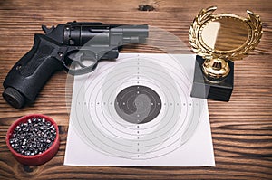 Best shooter award. Gun and paper target. Shooting practice. Shooting range.