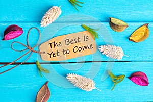 The best is yet to come text on paper tag