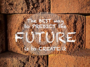 The best way to predict the future is to create it. Text on rock background. Inspirational motivational quote.