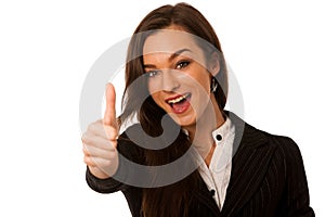 Besutiful business woman gesturing success with showing thumb up