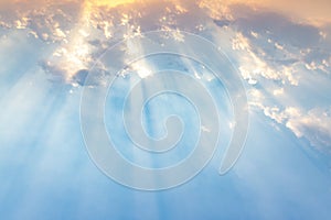 Besutiful ray of sunlight breaking through clouds at sunset