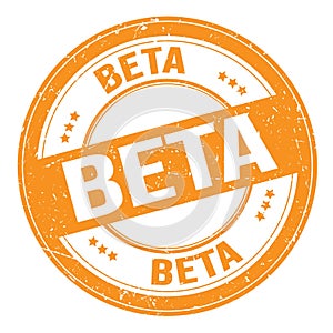 BETA text written on orange round stamp sign