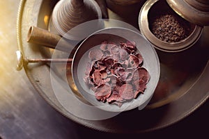 Betel nut in brass bowl, receptacle for betel nut and betel