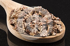 Betelnut on a wooden spoon