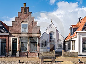 Bethel church and house with stepped gable in old town of Workum, Friesland, Netherlands