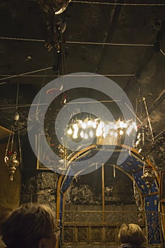 Bethlehem, Palestine - January 28, 2020: A silver star marks the traditional site of the birth of Jesus in Bethlehem`s Church of