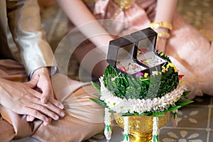 Betrothal and wedding rings / Traditional Thai wedding. - (Selective focus)