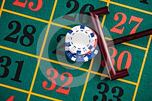 Betting casino chips on lucky number, roulette gambling