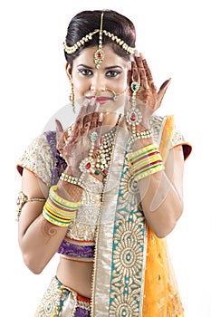 Beautiful Indian Bride with Mehendi hands or Henna