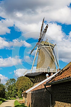 Beuautiful windmill at cycle path in countryside in summer - Hompesche molen, Stevensweert, Netherlands