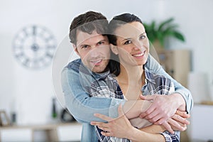 beutiful couple hugging at home