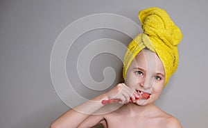 Beutiful girl brushing her teeths photo